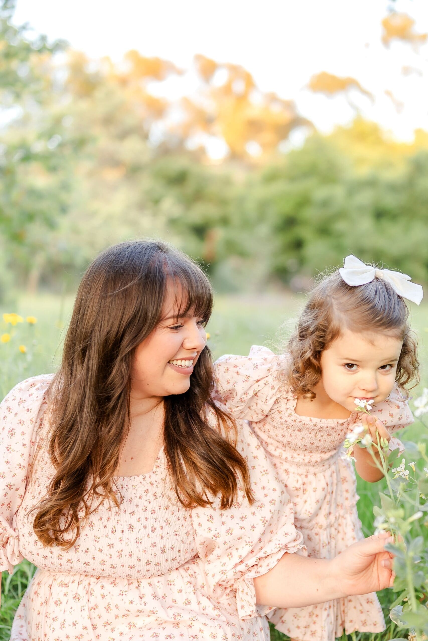 A series of candid photos showing joyful moments in a sunlit field with flowers and greenery.