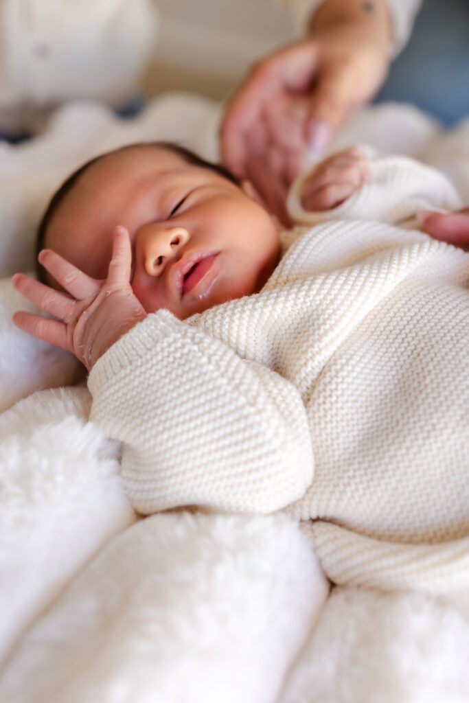 beautifully styled newborn photography studio setup at Spark Studios Huntington Beach with soft neutral backdrops and luxury props
