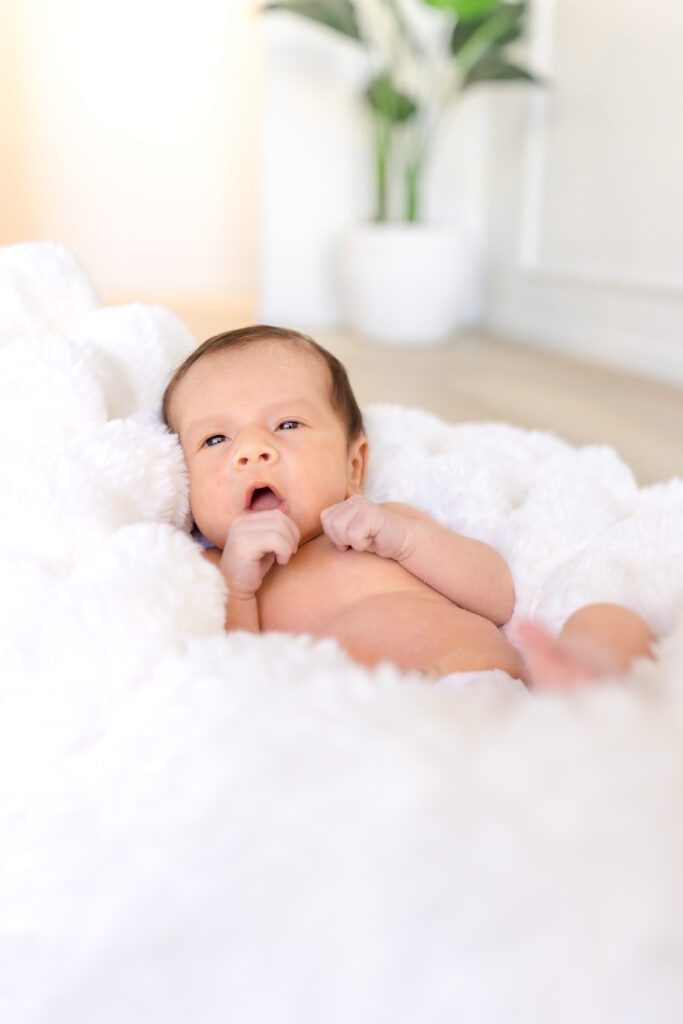 intimate lifestyle photo of mother and newborn at a luxury Huntington Beach studio session by Erin Custer Photography