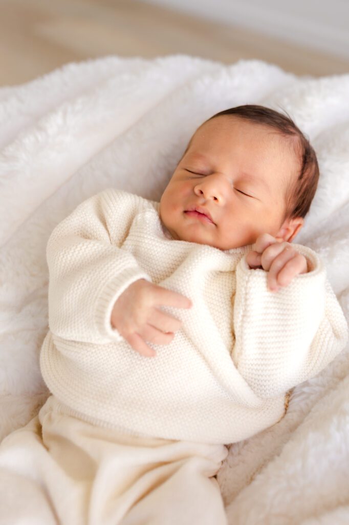baby posed / wrapped
posed newborn wrapped in cream swaddle at a luxury studio newborn session in Huntington Beach California