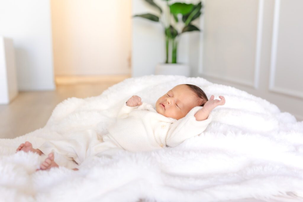 newborn baby sleeping peacefully during a luxury studio session with Huntington Beach newborn photographer Erin Custer