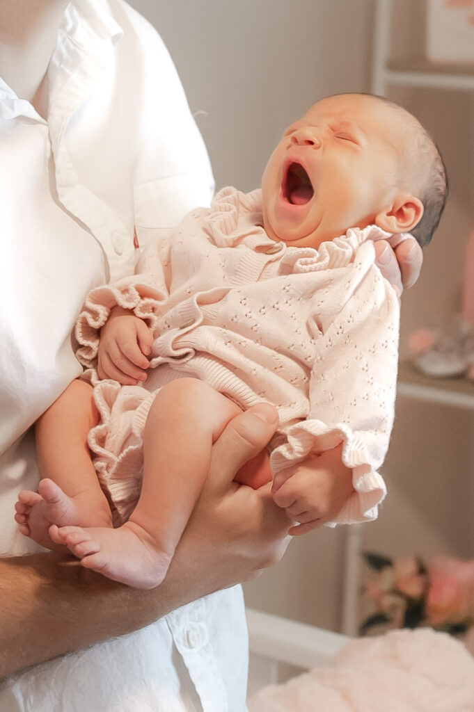 Newport beach newborn photographer dad hands baby.jpg